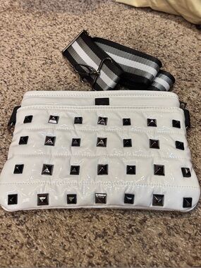 THINK ROYLN White Patent Crossbody with Black Studs and Striped Strap